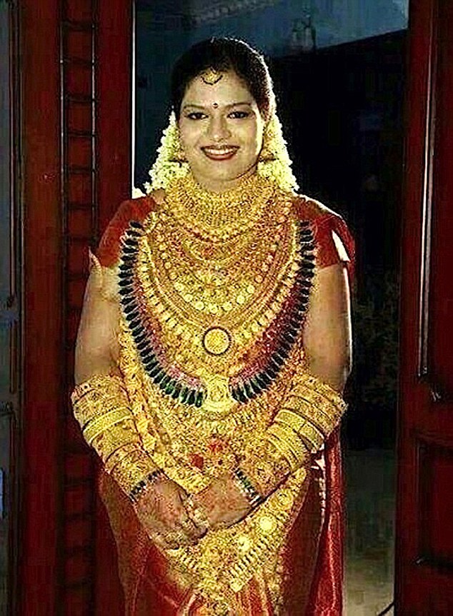 Pic shows: Bride was covered in gold for the wedding in India. An Indian sweet maker made sure his daughter was the golden girl at her upcoming wedding by covering her in gold jewellery worth more than 400,000 GBP. The man who was not named nevertheless came under fire after it was revealed he needed a police guard to protect him and his daughter as they turned up covered in gold for the wedding in India's southern Andhra Pradesh state. Police spokesman Sandeep Kumar in Tirupati, a holy city known for its famous temple of Lord Vishnu, confirmed that the man and his daughter, who he declined to name, had worn gold jewellery throughout the ceremony. He said: "It is not a crime to wear such a large amount of gold, but there could have been a crime once people heard about it. We just wanted to make sure there were no problems in advance." The move was widely condemned on social media sites once the images from a mobile phone was shared, with people branding it both humiliating and shocking. Indians, one of the world's largest consumers of gold, spend huge amounts in buying gold jewellery for family weddings, and recently several wealthy Indians have been seen sporting shirts made out of solid gold thread. This father of the bride reportedly made his millions from selling confectionery in India. (ends)